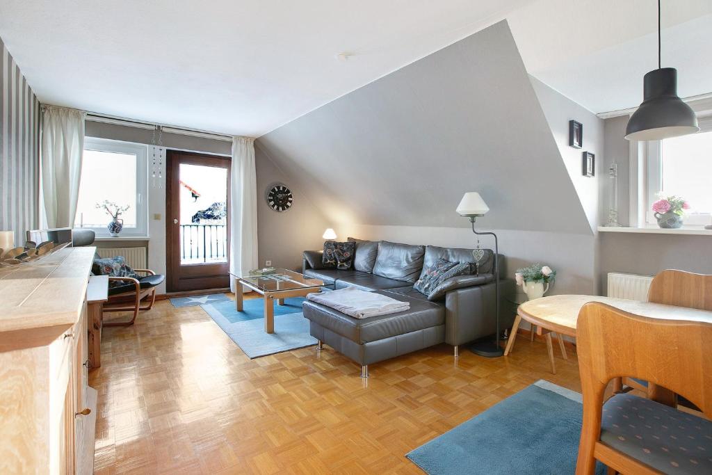 a living room with a couch and a table at Ferienwohnung Nordmeer in Kappeln
