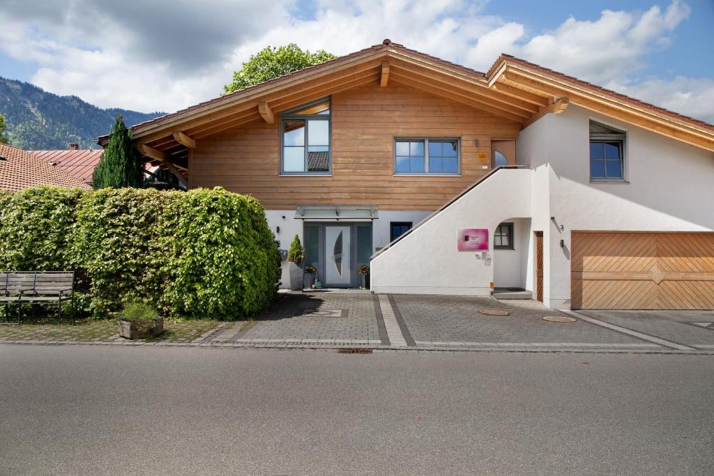 a house with a wooden roof at Ferienwohnung Gallist in Oberammergau