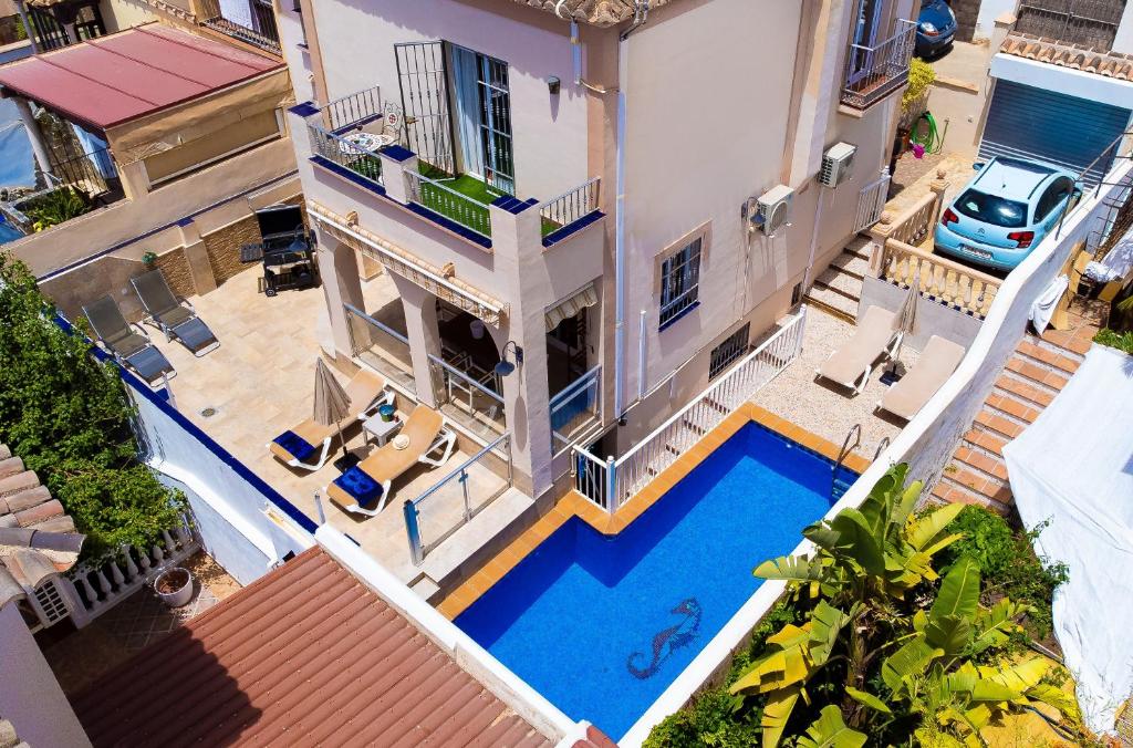 an aerial view of a house with a swimming pool at Villa Palomas in Nerja