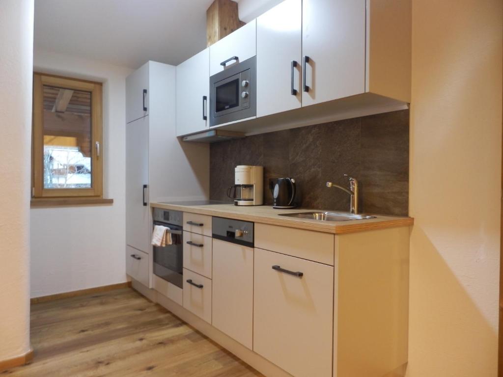 Kuchyň nebo kuchyňský kout v ubytování Haus Alpenflora