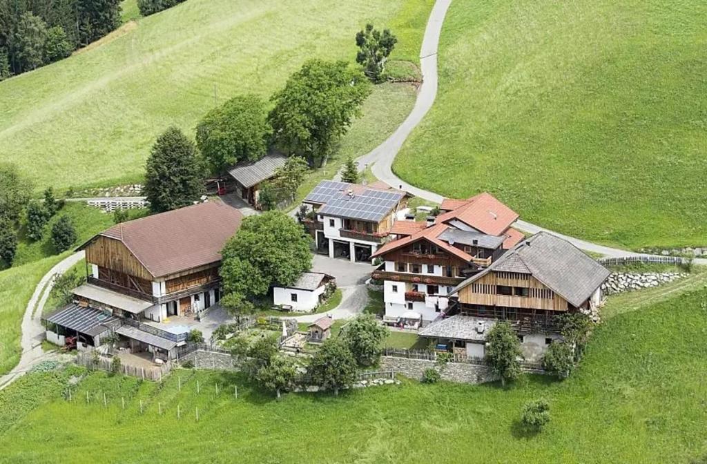 an aerial view of a large house on a hill at Galtinerhof in Rodengo