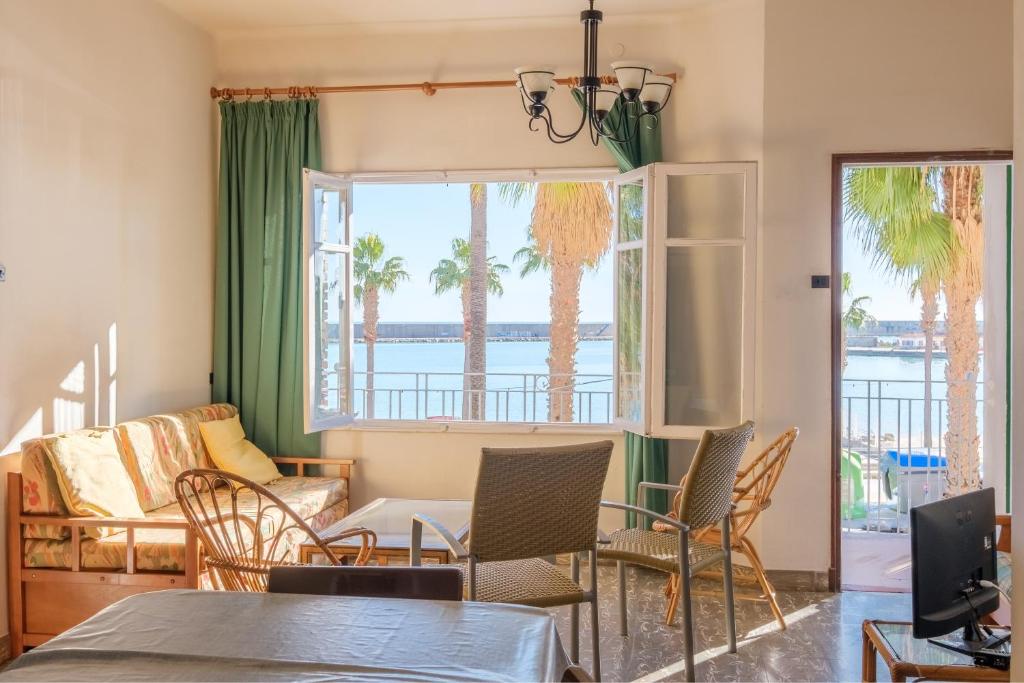 a living room with a view of the water at Apartamento las Palmeras 2 in Benicarló