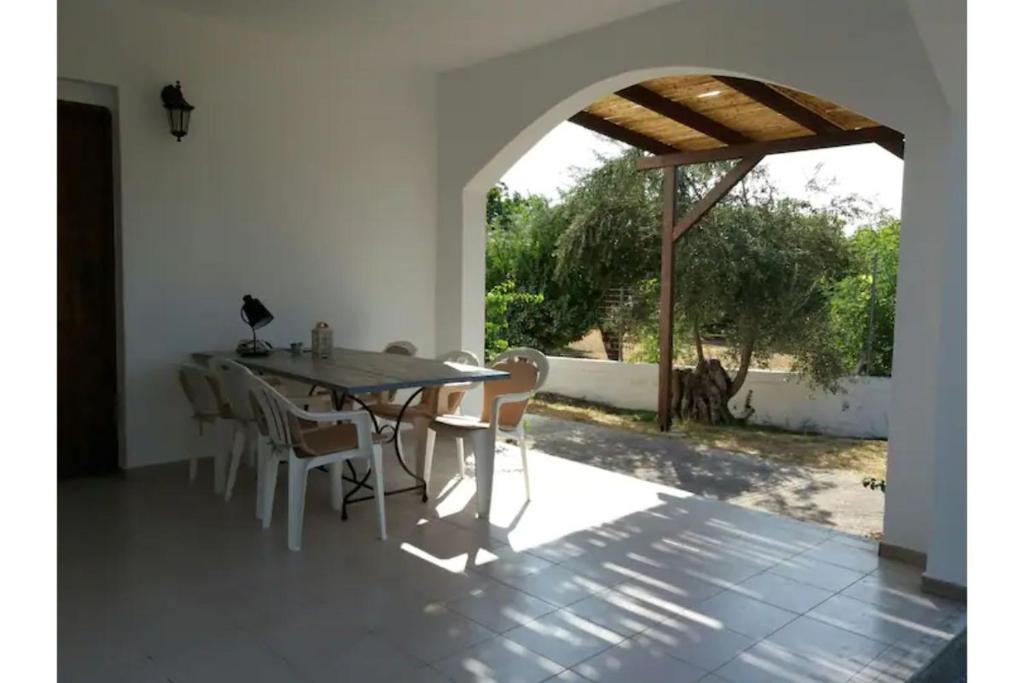 a dining room with a table and chairs at Maria's house 2 in Ilia