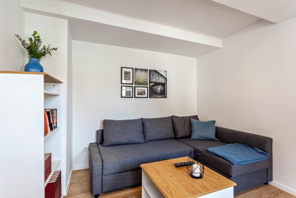 a living room with a couch and a table at alter Speicher in Warendorf