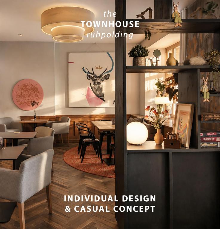 a magazine mockup of a restaurant with a table and chairs at The Townhouse Ruhpolding - Individual Design & Casual Concept - Chiemgau Karte in Ruhpolding