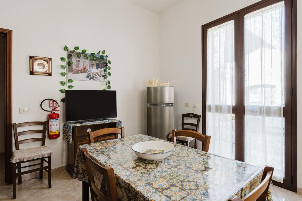 a dining room with a table with a bowl on it at Casa La Piazzetta in Marsala