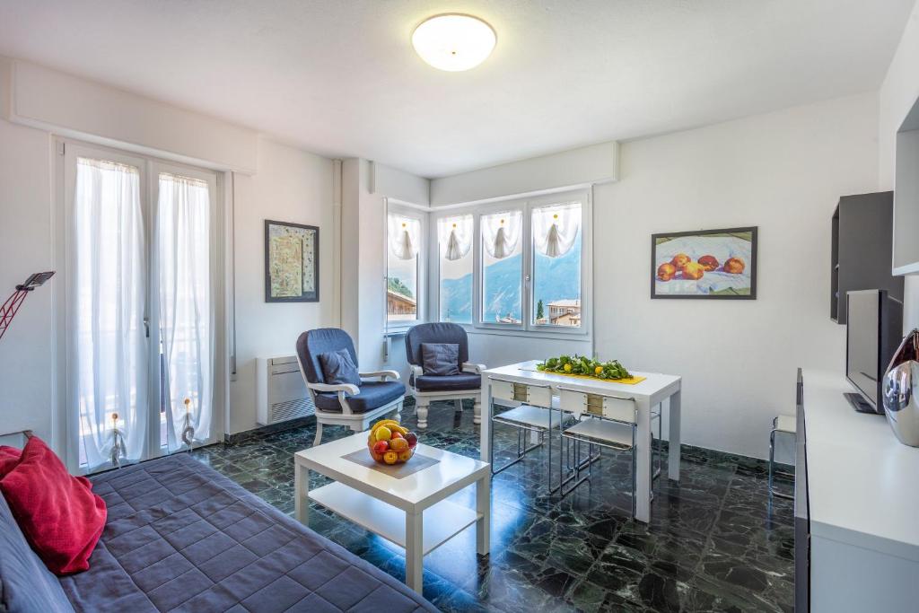 a living room with a table and two chairs at Liver 203 in Tremosine Sul Garda