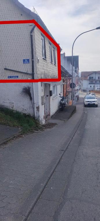 a car is parked on a street next to a building at Peter in Michelstadt