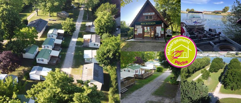 an aerial view of a house with a sign on it at Camping Arquebuse in Auxonne