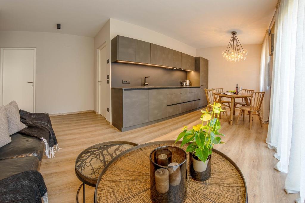 a living room with a couch and a table at Lores Loft in Merano