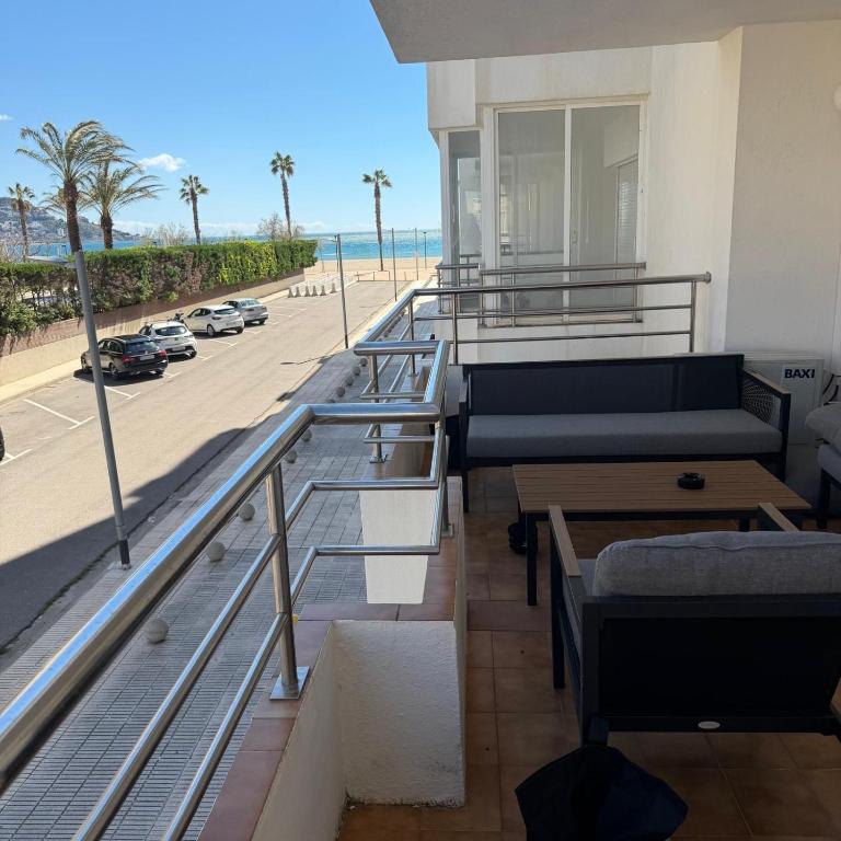 a room with a balcony with a view of the beach at The Miks Sur Mer 2 in Roses