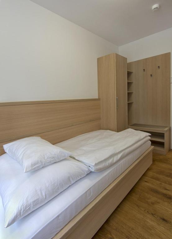 Postel nebo postele na pokoji v ubytování HOTEL A RESTAURACE U STAVAŘE
