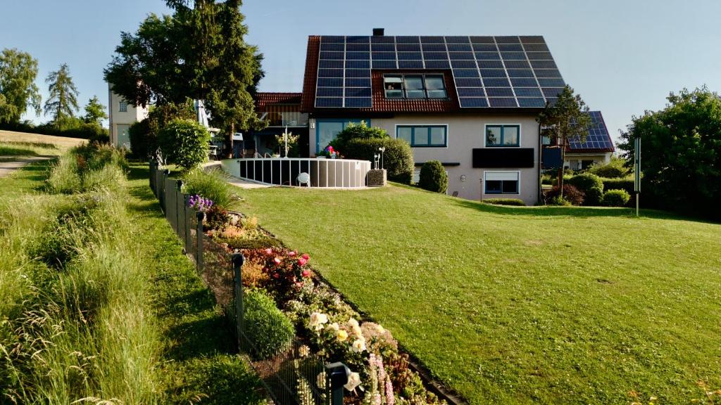 a house with a lot of solar panels on the roof at Heim Lisse in Dietenhofen