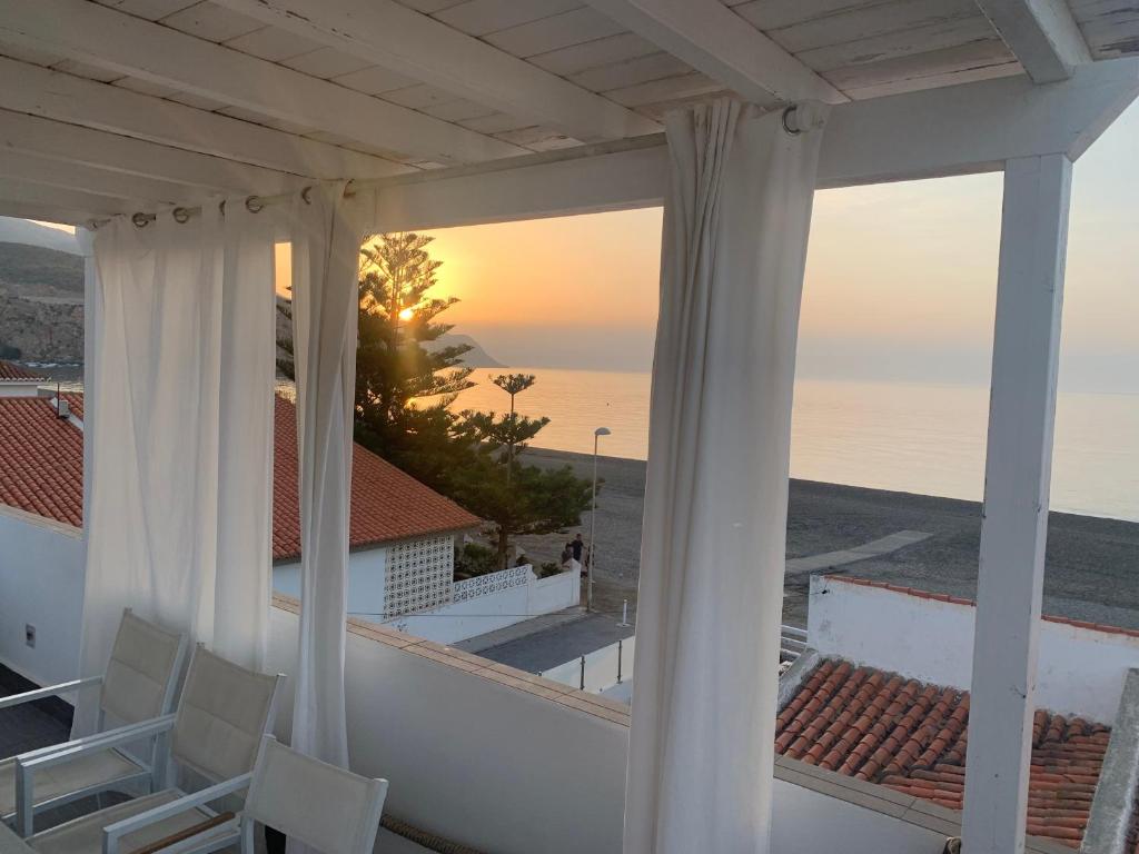 a view of the ocean from the balcony of a house at Casa Sueña in Calahonda