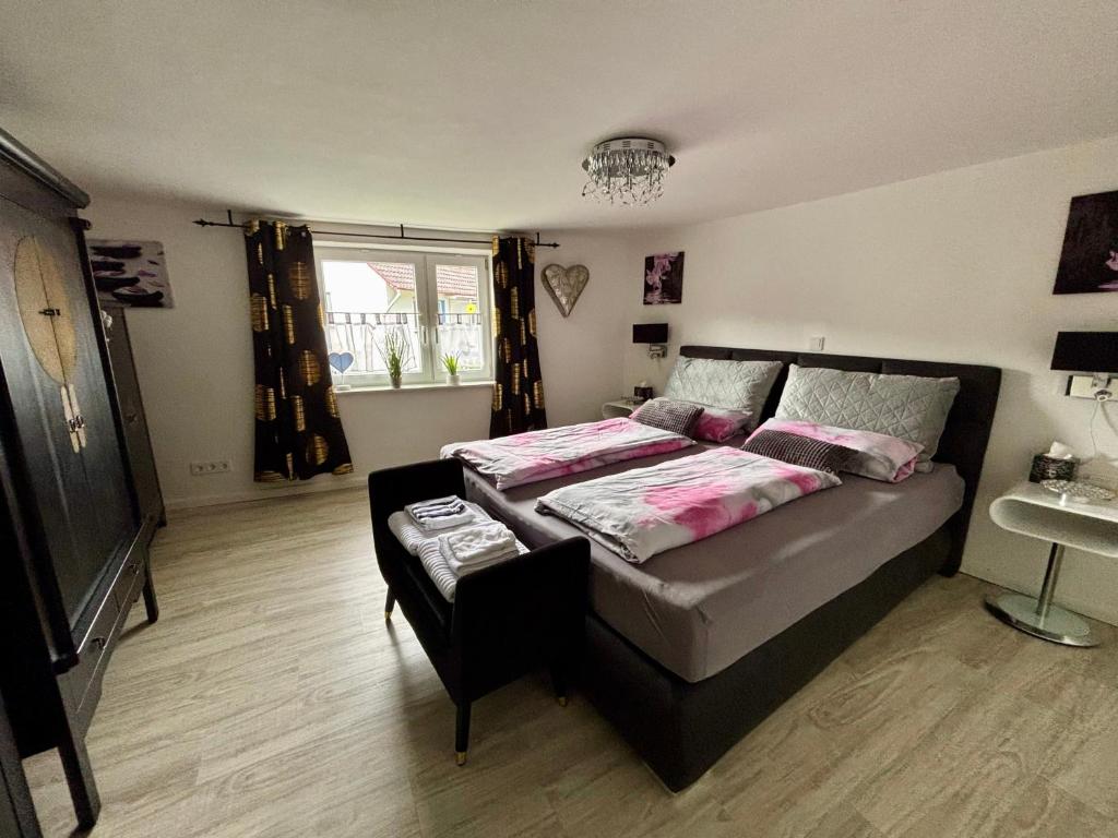 a bedroom with a bed and a sink in it at Kleiner Kalle in Melsungen