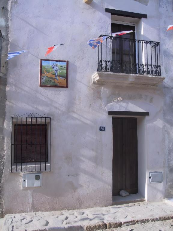 a white building with kites flying in the air at Casa Bohemio - Tabarca in Tabarca
