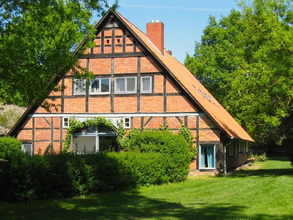 a large brick house with a gambrel roof at Historisches Haus Uhlenhorst in Trebel