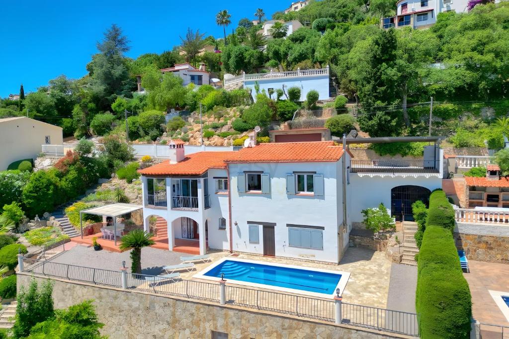 an aerial view of a house with a swimming pool at Villa Romantica by Easy Brava in Calonge