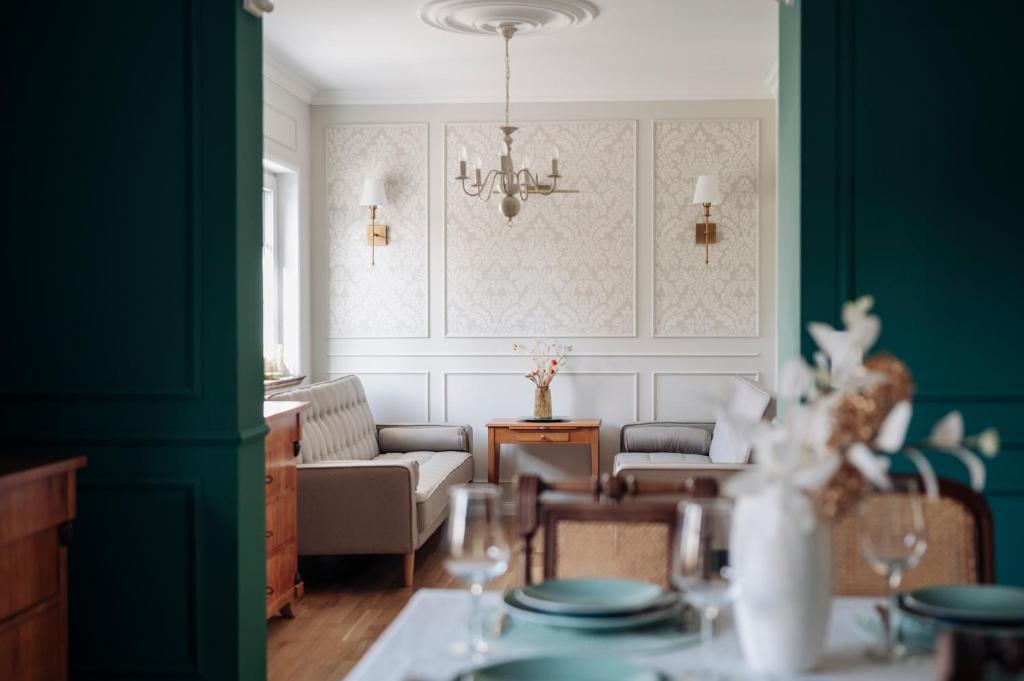 a living room with a couch and a table at Villa Sand in Bad Emstal