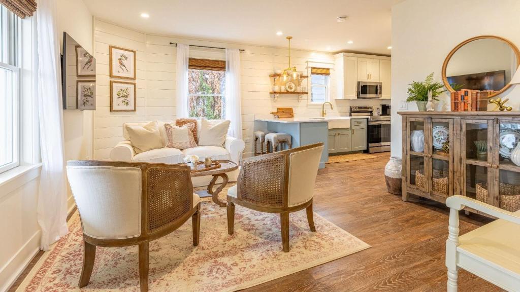 a living room with a table and chairs and a kitchen at Kildahl House - Boutique Farmhouse Suite #1 in West Dundee