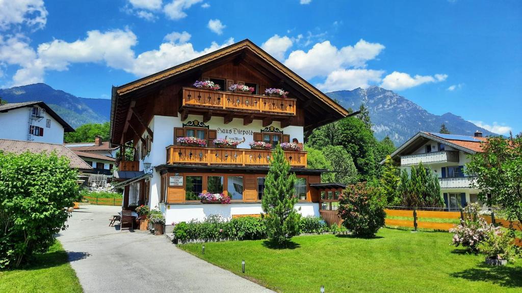 a house with balconies on the side of it at Ferienwohnung Alpspitze in Grainau