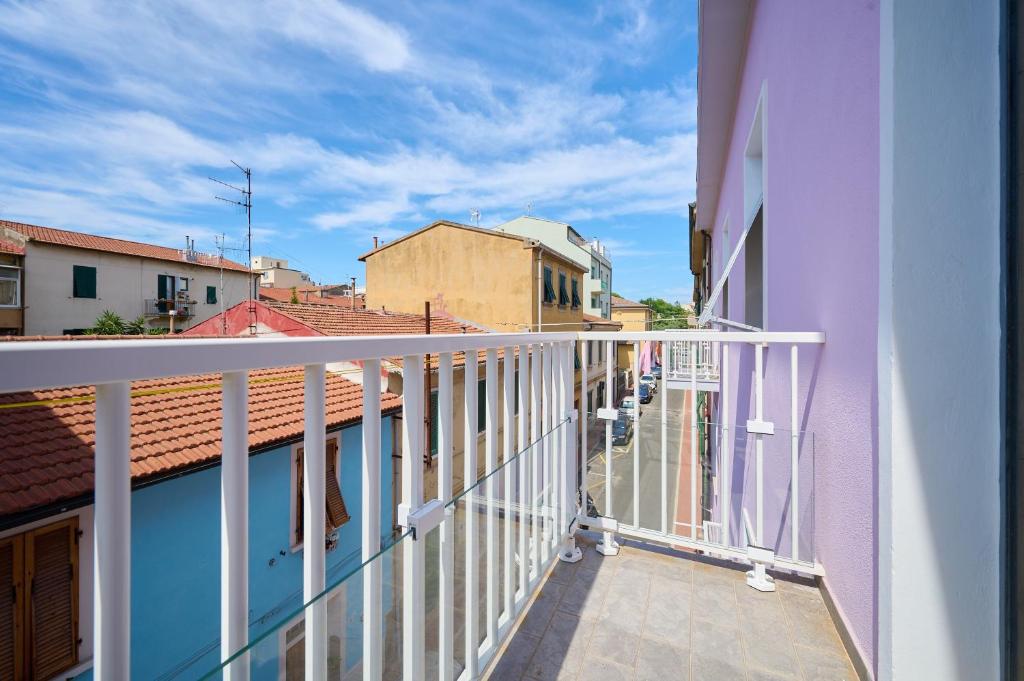 a balcony with a view of a city at Holy days in Piombino