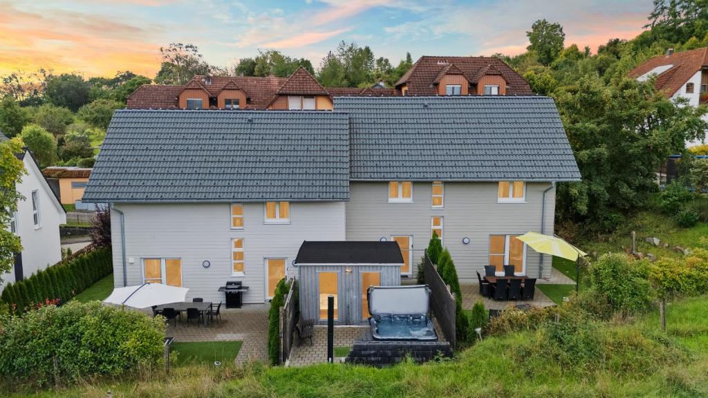 a large white house with a roof at Ferienhäuser Stickel in Freudenstadt