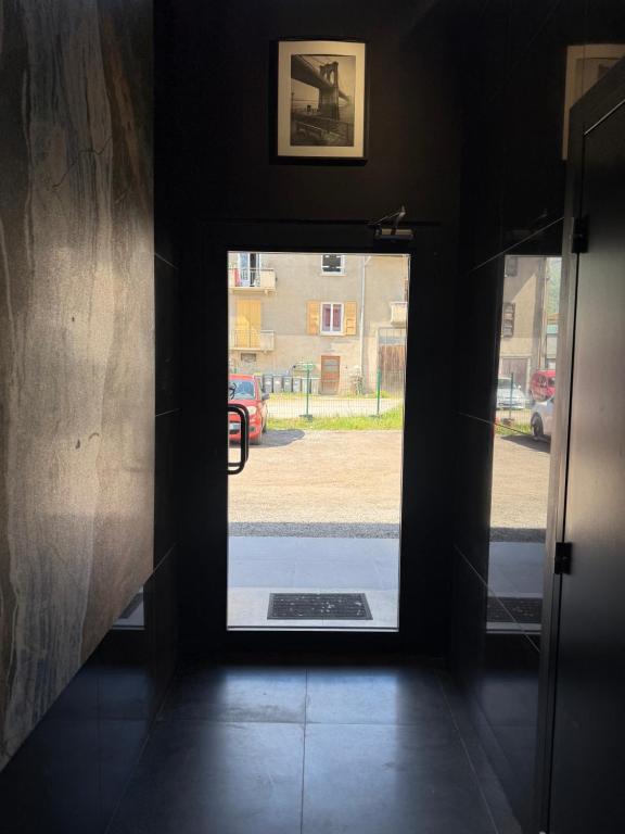an open door with a view of a street at T2 modern in Frontenex-Villard-Rosset