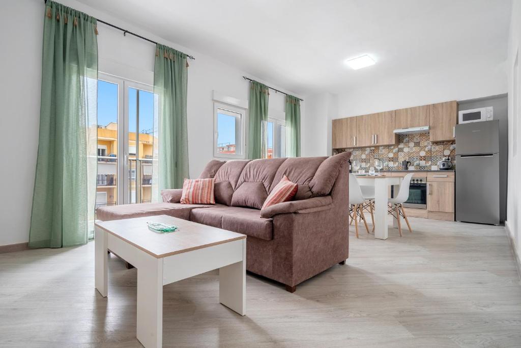 a living room with a couch and a table at Cambrils Turistic 3b in Cambrils