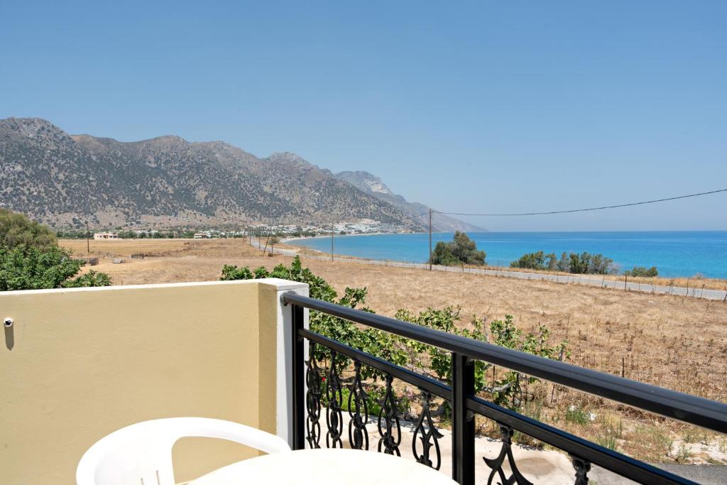 a balcony with a view of the ocean at Athina seaside in Kardamaina