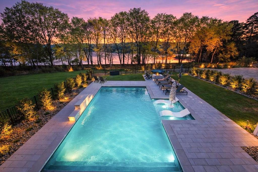 an overhead view of a swimming pool with lounge chairs at Paddle Pointe in Sherrills Ford