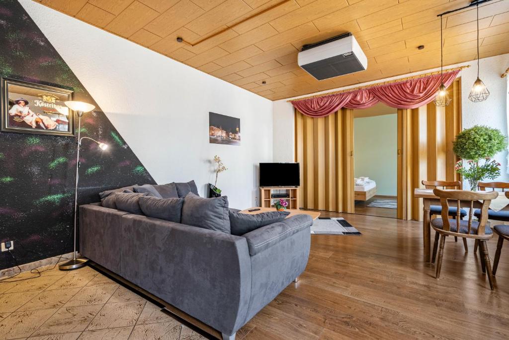 a living room with a couch and a table at Ferienhaus Nestwärme in Calau