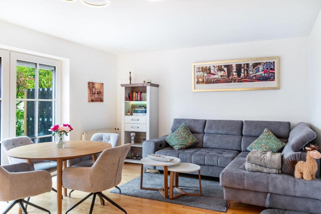 a living room with a couch and a table at Ferienhaus Franz in Jemgum