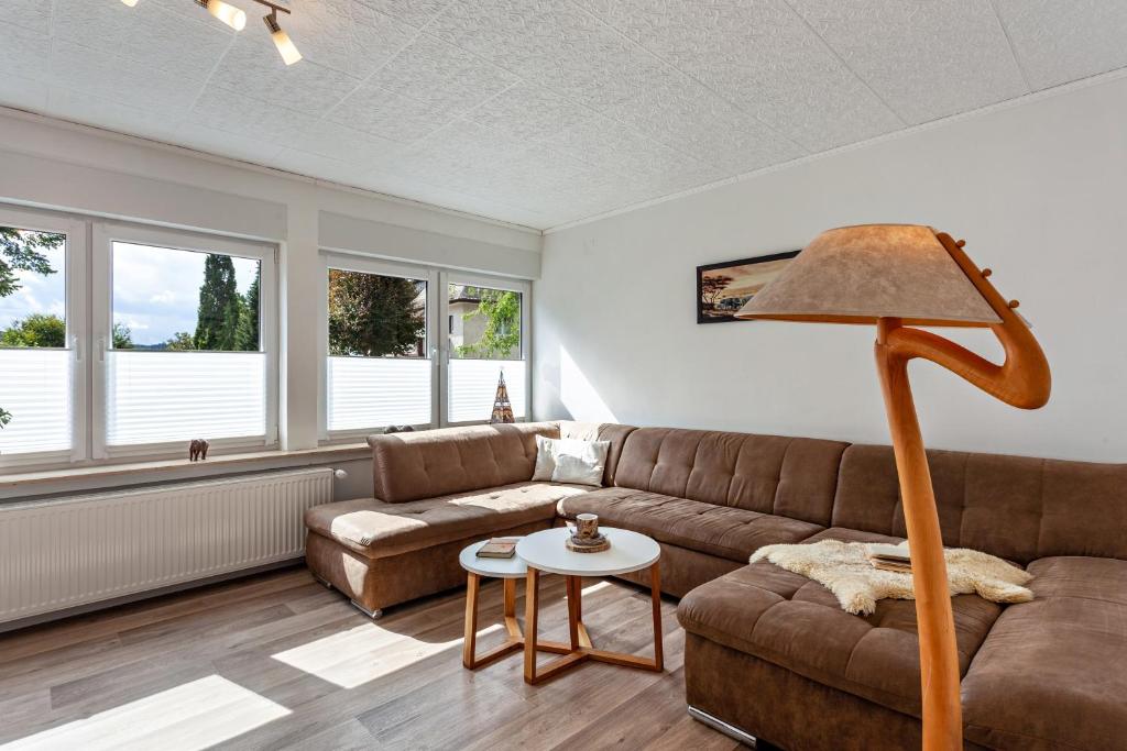 a living room with a couch and a table at Ferienwohnung Elim in Olsberg