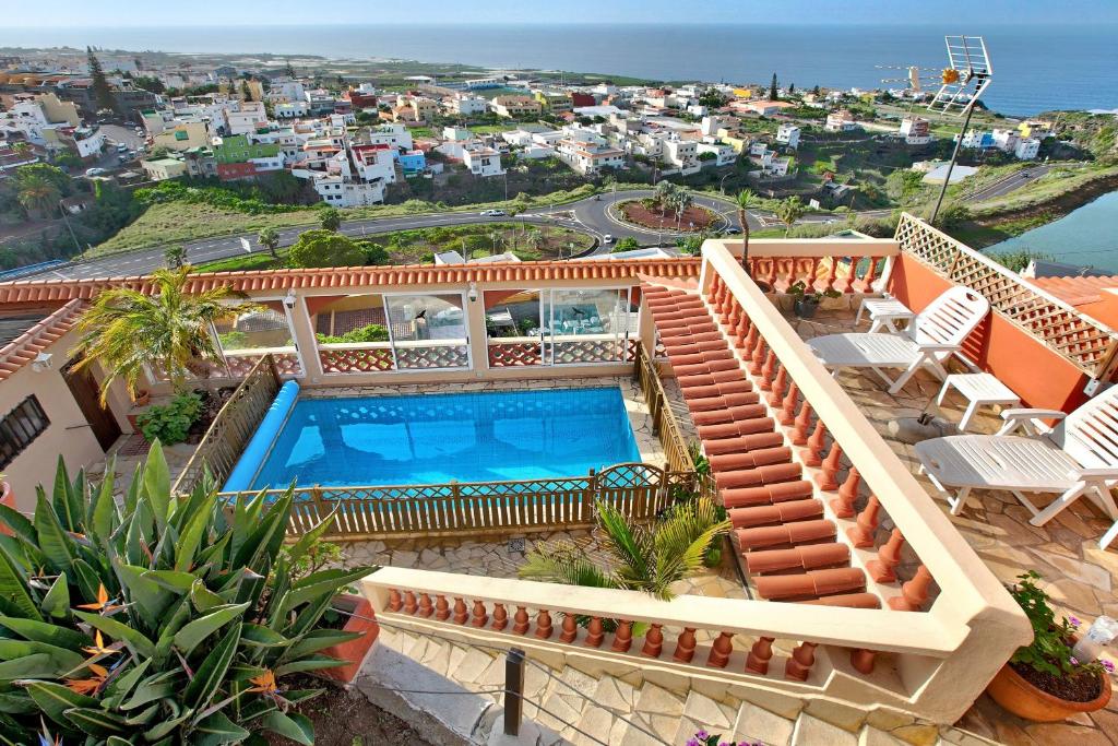 a villa with a swimming pool on top of a house at Villa Petite Paradise in Las Lagunas