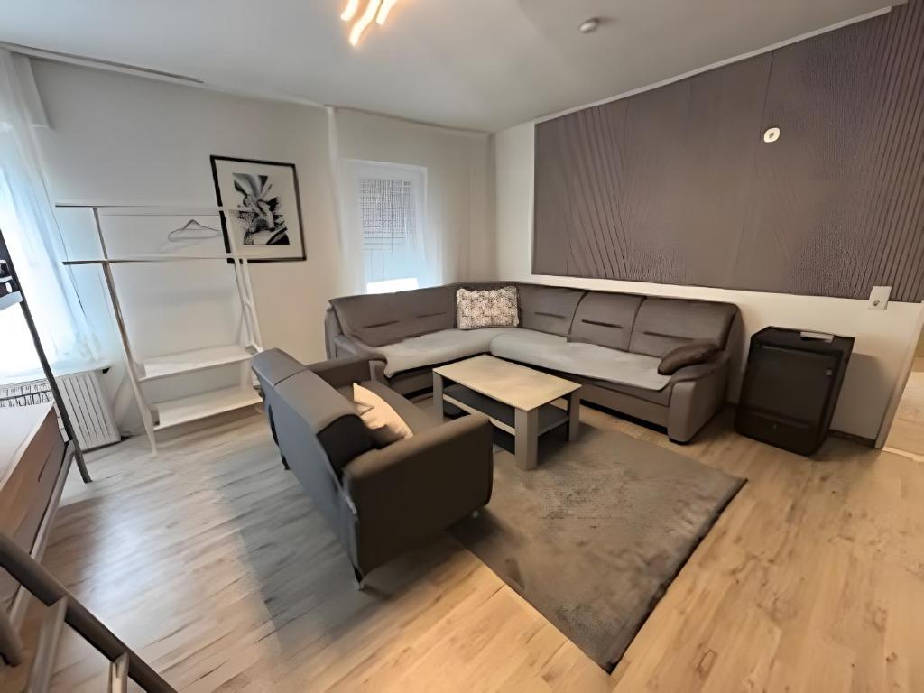 a living room with a couch and a table at Haci Babas Home in Bestwig