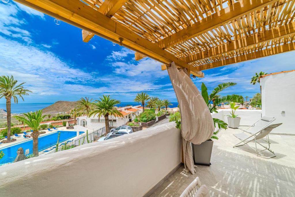 a view of the pool from the balcony of a villa at Oceania Villa Private Pool Garden in Chayofa