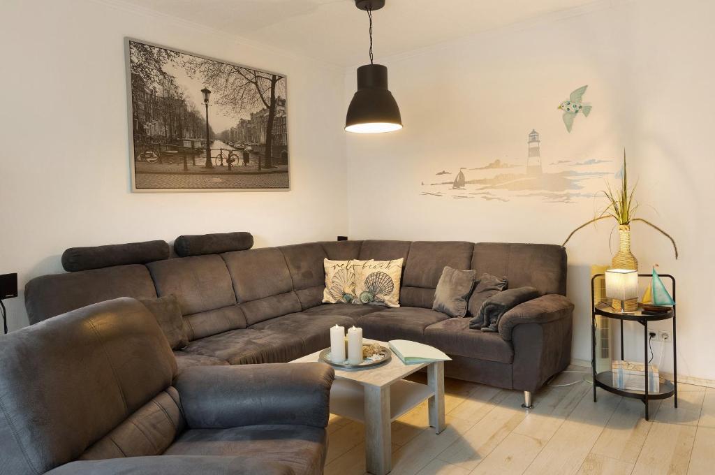 a living room with a couch and a table at Haus Mari in Gommern