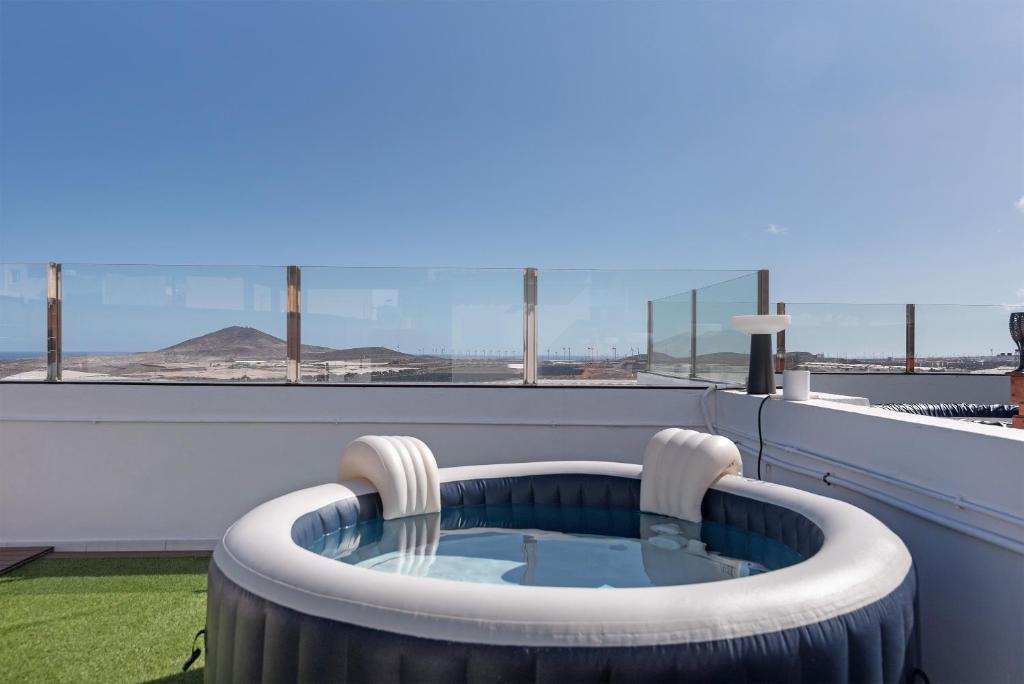 a hot tub on the roof of a building at One life one dream Gran Canaria in Carrizal