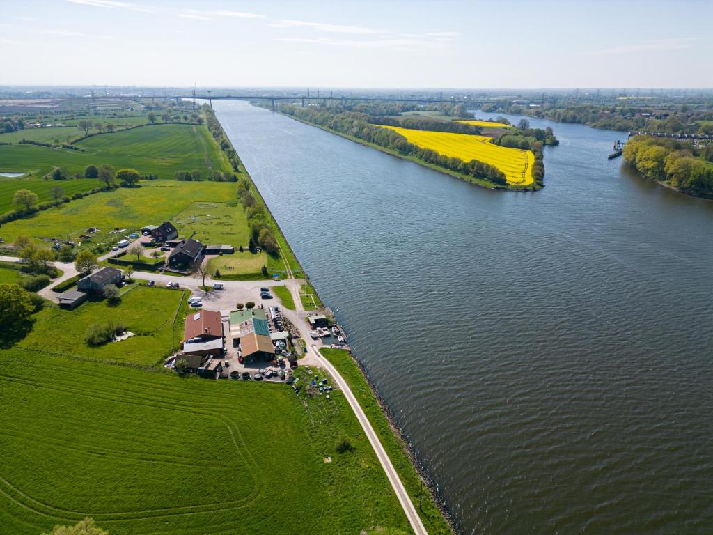 an aerial view of a river with a farm at Ferienwohnung Barsch in Rade