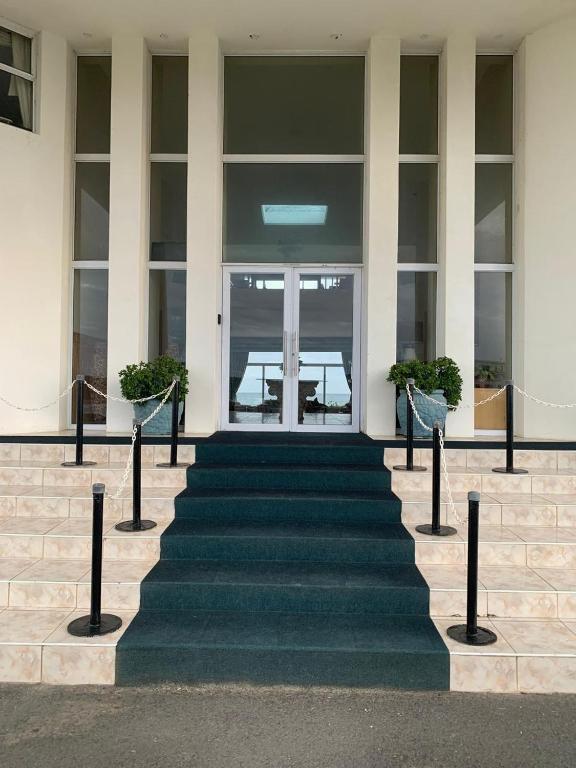 a set of stairs in front of a building at The White House Guesthouse in East London