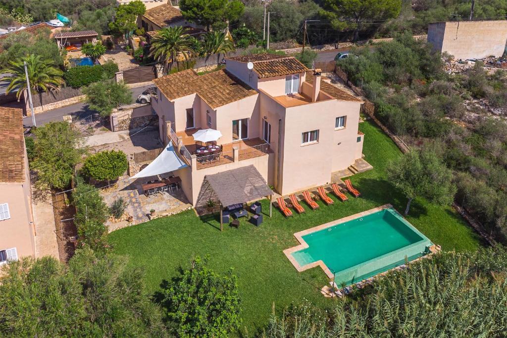 an aerial view of a house with a swimming pool at Villa Paqui in Portopetro