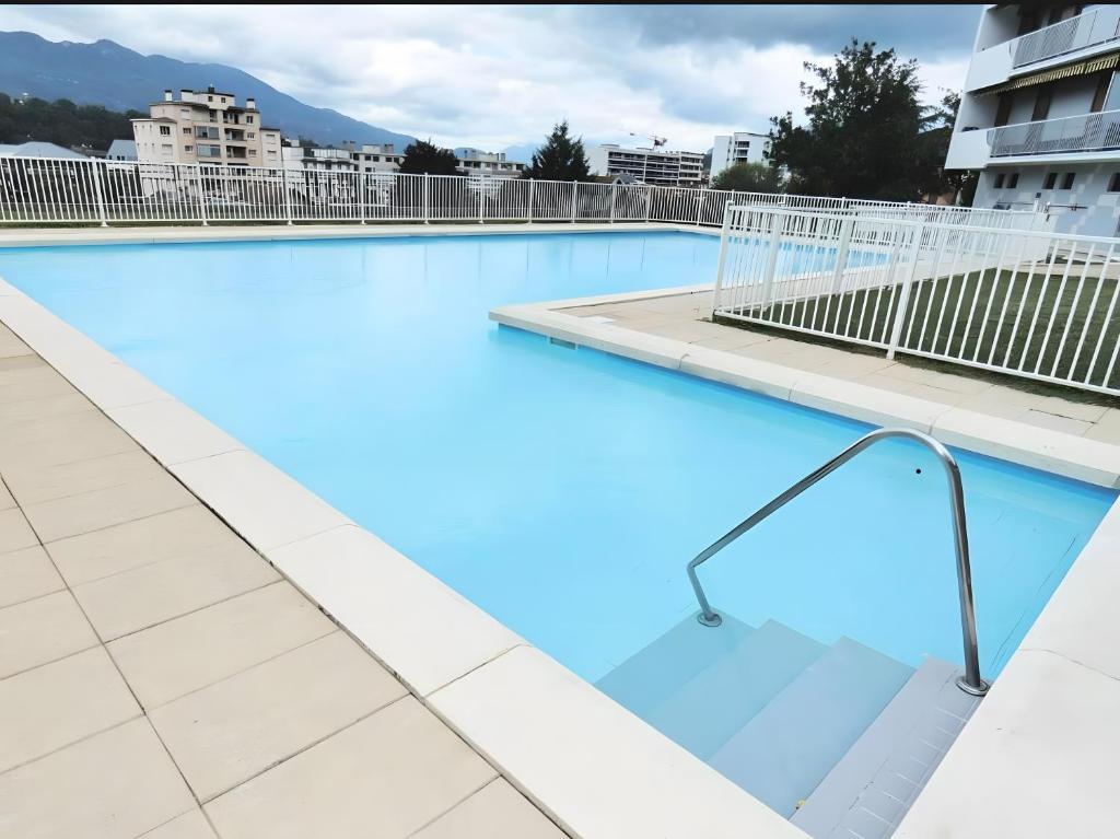 a swimming pool on the roof of a building at Studio Montcalm in Aix-les-Bains