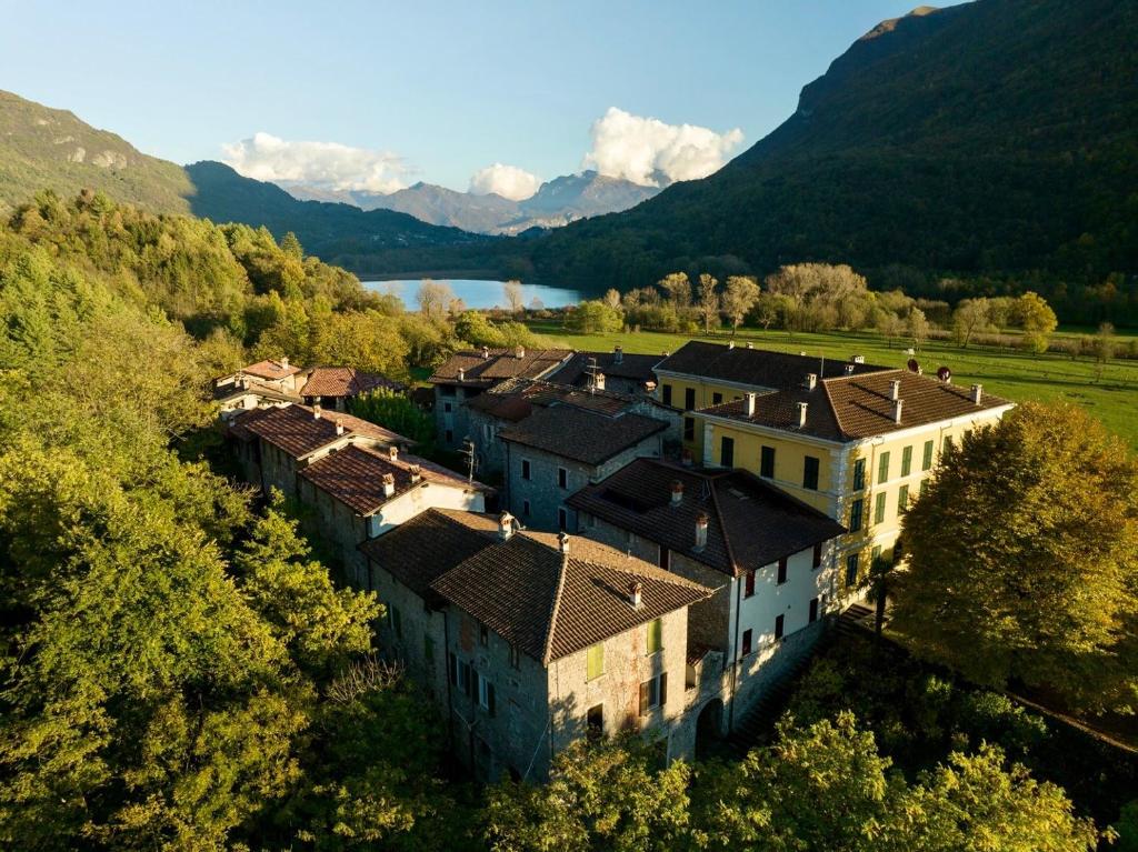 an aerial view of a village in the mountains at Workation Castle - Casa Tremezzo in Carlazzo