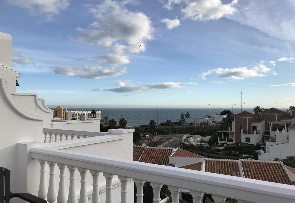 a view of the ocean from the balcony of a house at Townhouse with Sea View in Nerja