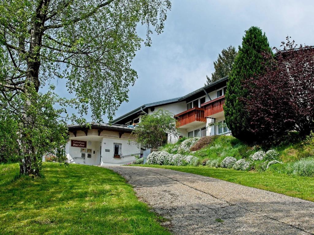 a house on a hill next to a driveway at Fidelis-Bühl Muggenbrunn in Todtnau