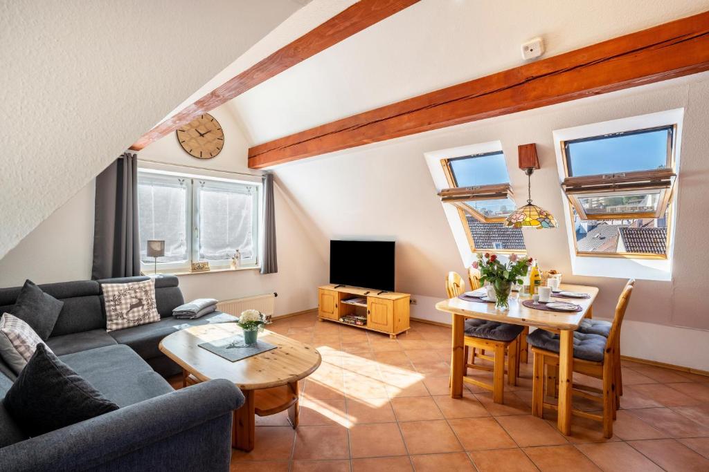 a living room with a couch and a table at Schwarzwaldnest in Bad Wildbad