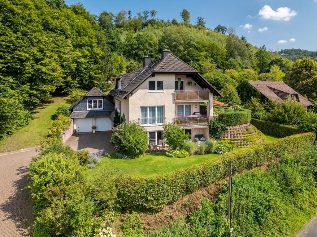 an aerial view of a house on a hill at Ferienwohnung Fasse in Uslar