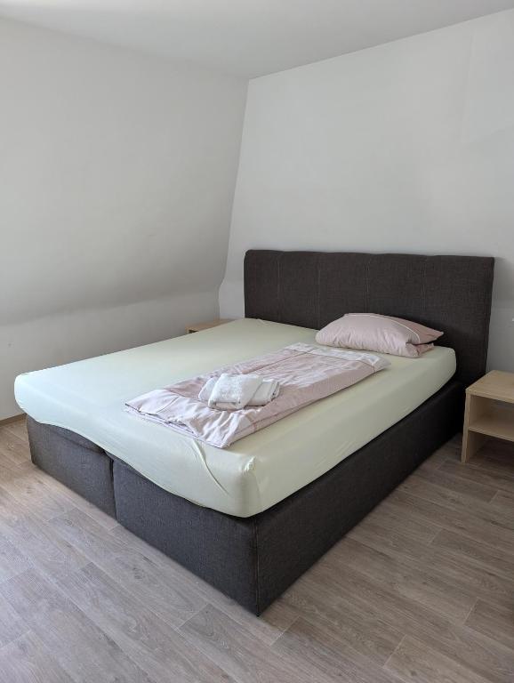 a bed sitting in a room with at Ferienwohnung Beck in Ansbach