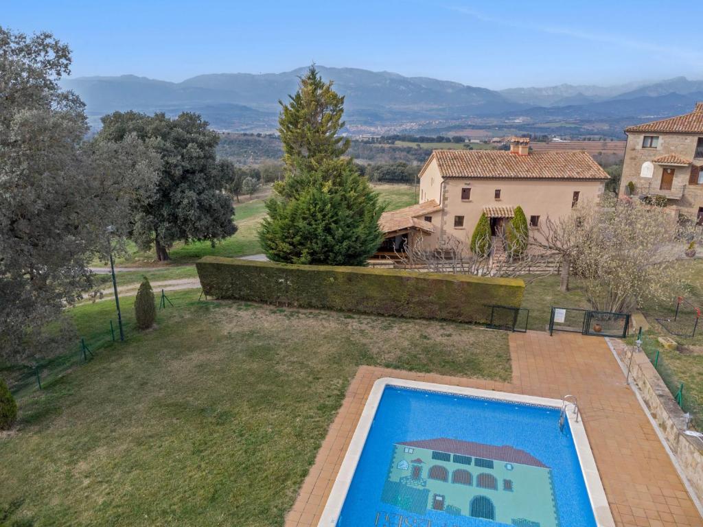 an aerial view of a yard with a swimming pool at Masoveria De Vilanova in Sagás